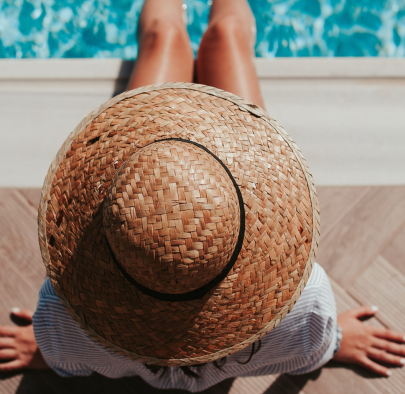 After Sun Skincare - Image Of Woman In A Sunhat