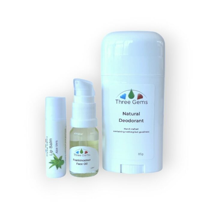 Three Gems Natural Skincare set of personal care essentials. Natural Deodorant, Frankincense face Oil, and Aloe Vera Lip Balm.
