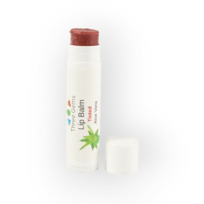 Three Gems Natural Skincare tinted aloe vera lip balm with lid off showing colour. 5g tube.